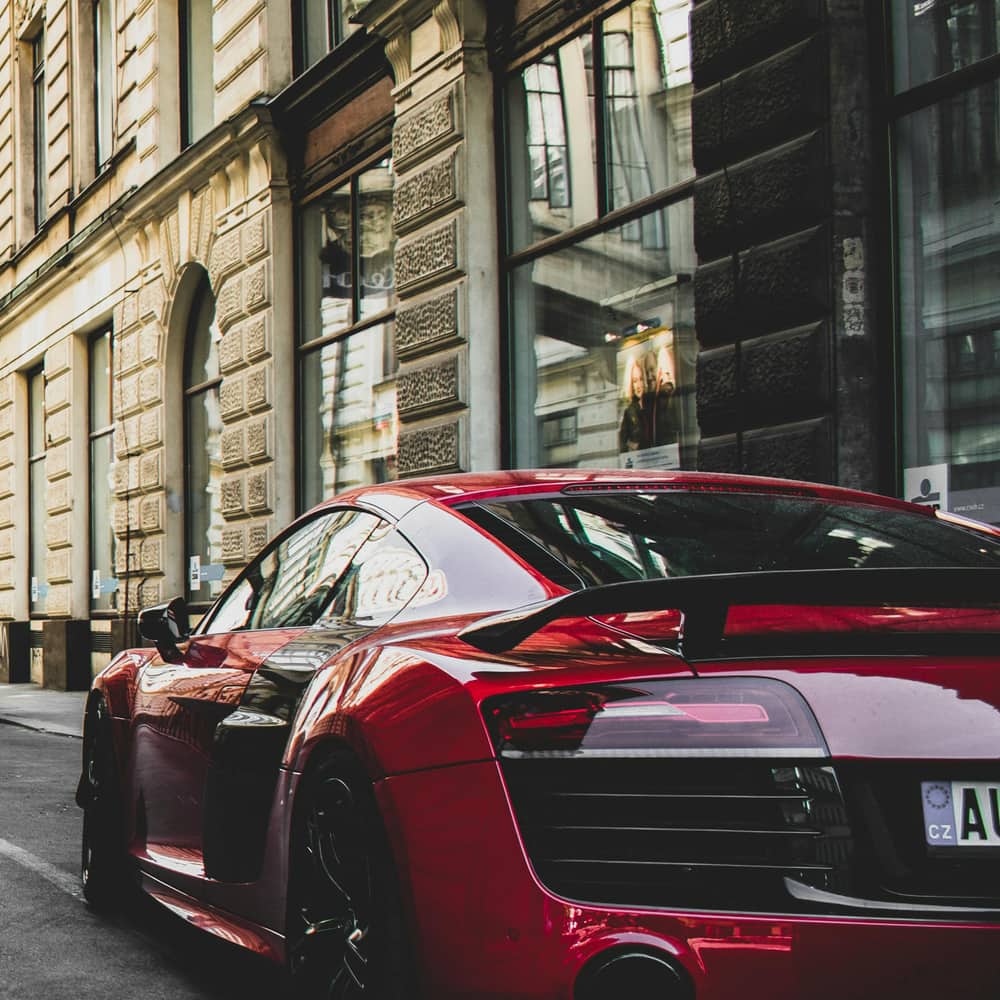 Modern car front exterior close-up with LED headlights and sleek grille design