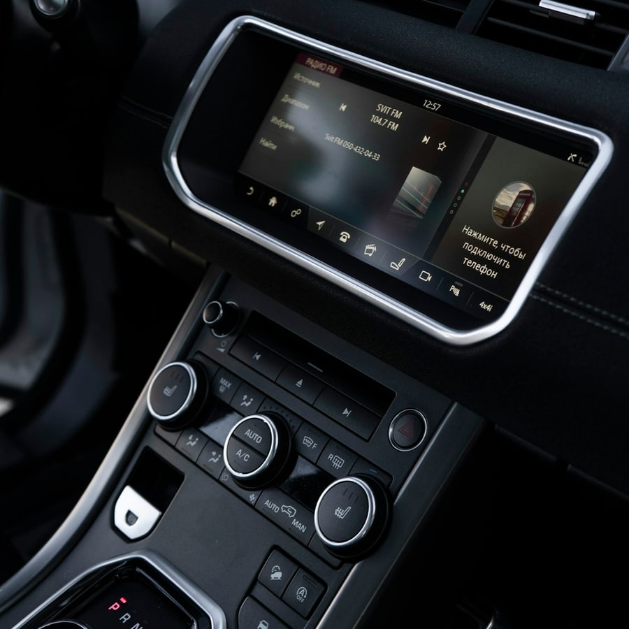 Modern vehicle interior with digital gauge cluster and large center touchscreen
